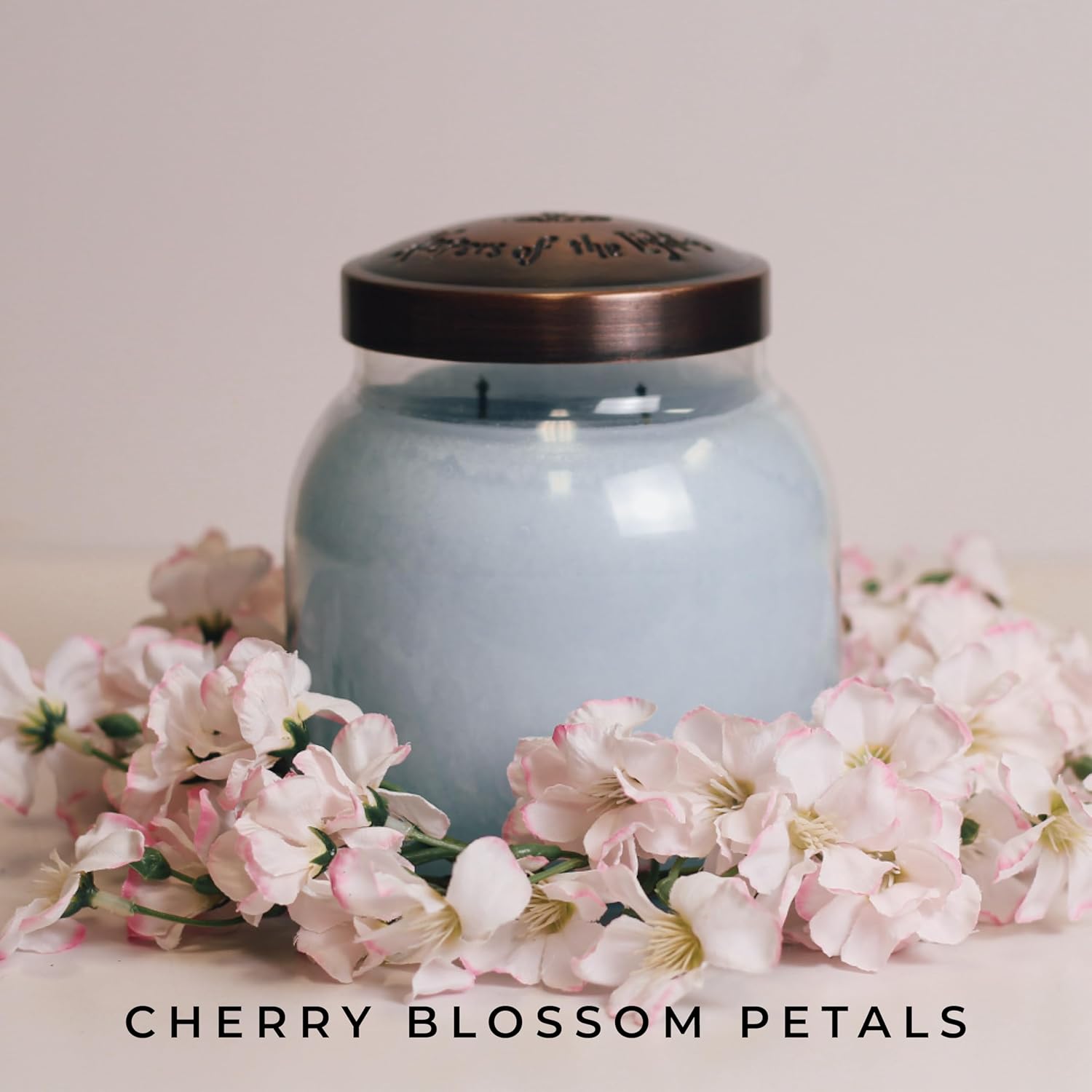 A Cheerful Giver Candle Ring with Cherry Blossom Petals 1